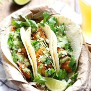Crispy Fish Tacos with Jalapeño Sauce - beer-battered with a cornmeal crust for an extra yummy texture, plus the spicy-cool combo of that creamy jalapeño sauce. Summer food! | pinchofyum.com
