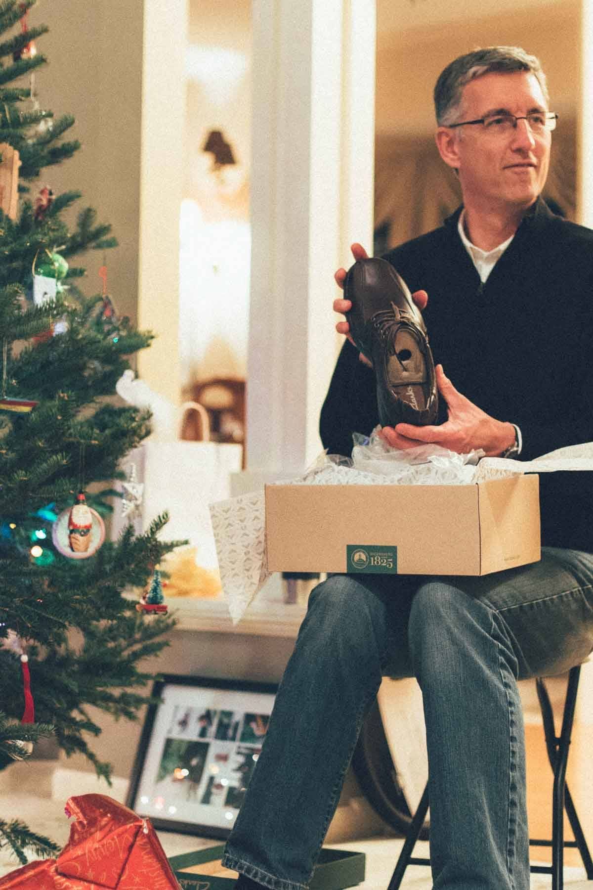 Man holding a shoe.