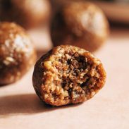 Pecan pie energy bite with a bite taken out of it