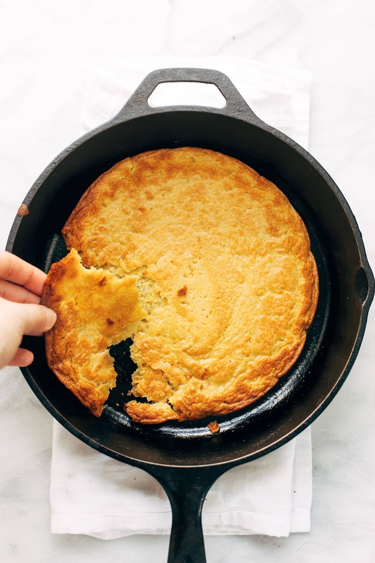 Socca in a cast iron skillet.