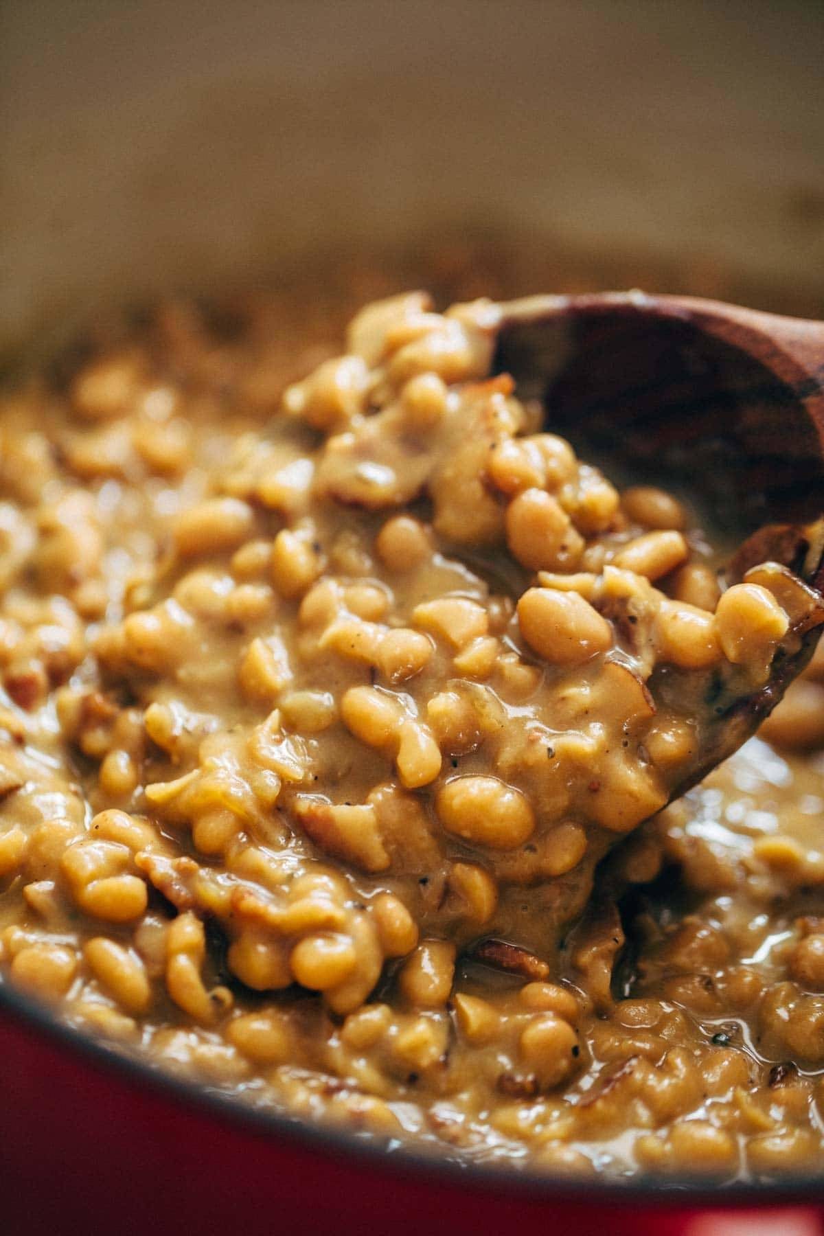 Homemade Brown Sugar Baked Beans! They are saucy, semi-creamy, brown sugar sweet + smoky bacon salty, and deliciously comforting. Five basic ingredients! | pinchofyum.com